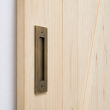 Wooden door handle on a wooden door with a white background